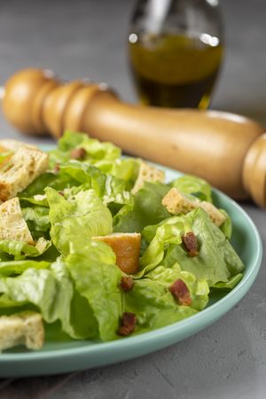 Caesar salad with croutons and bacon.