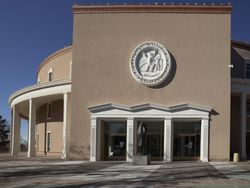 The New Mexico seal on a state capital building in Santa Fe 0vMoLb