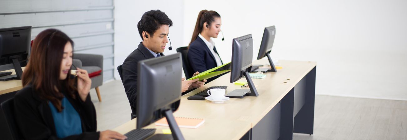 Banner of people working in a call center in Asia