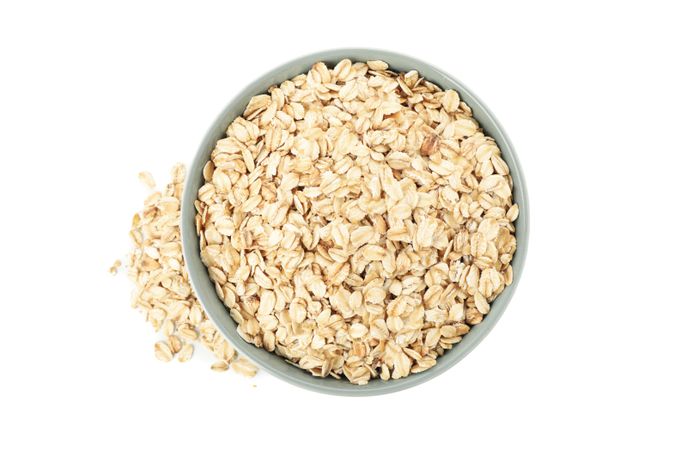 Bowl with oatmeal flakes isolated on plain background