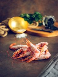 Raw prawns on table in domestic kitchen