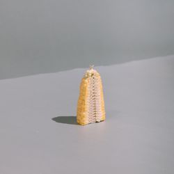 Corn cut in half on kitchen table