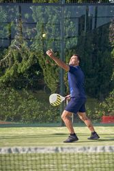 Man playing padel on court