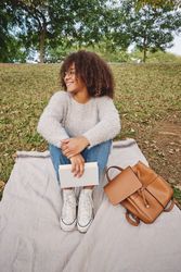 Black woman resting in green park