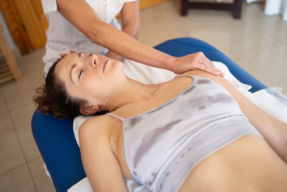 Relaxed female patient getting physiotherapy treatment