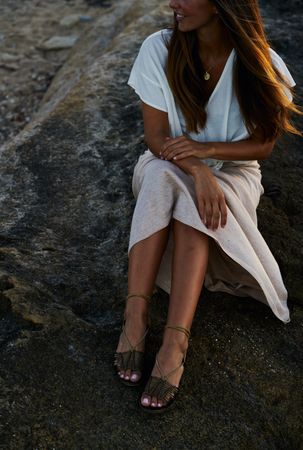 young woman posing on rock