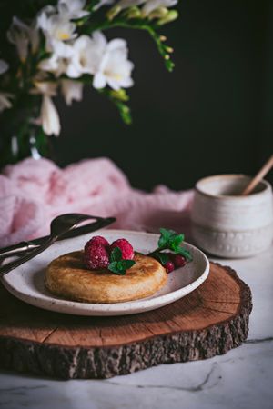Pancake with fresh raspberry on plate