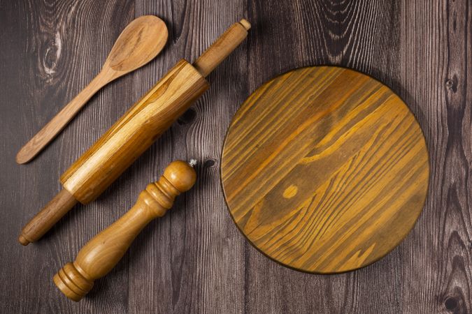 Empty pizza board on rustic wooden table. Top view image.