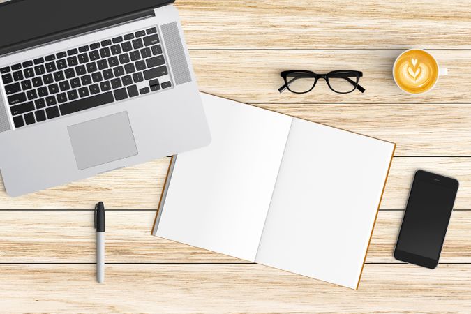 Modern workspace with coffee cup, smartphone, paper, notebook, tablet and laptop copy space