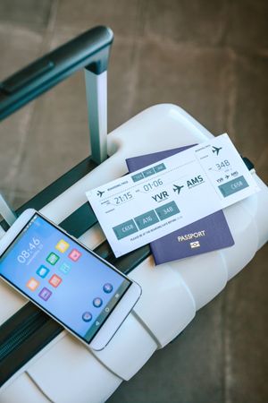 Suitcase with air ticket, passport and cell phone