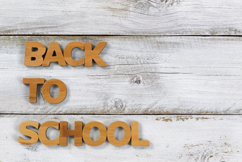 Back to school letters on old wood