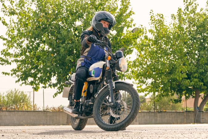 Motorcyclist riding motorbike during lesson on motordrome