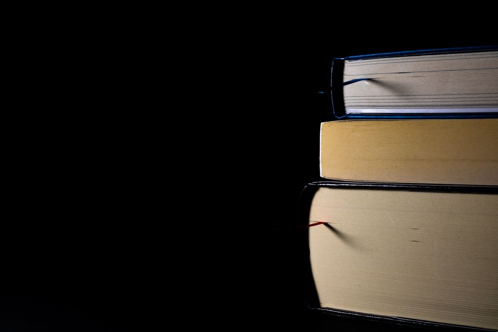 Stack of books in dark background