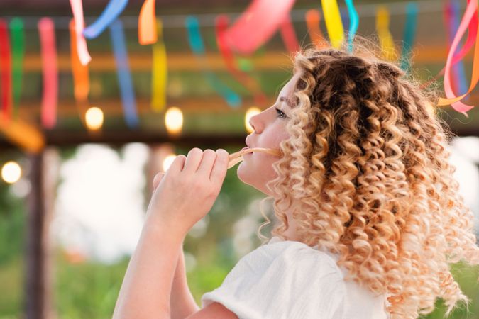 Portrait curly haired woman outdoors
