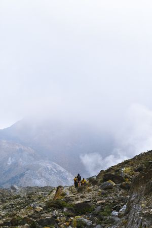 People standing on top of mountain