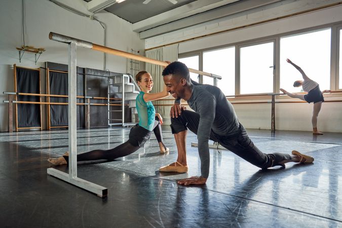 Couple of two dancers in a class doing a training in ballet academy