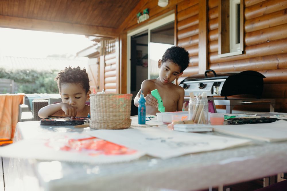 Black kids painting together