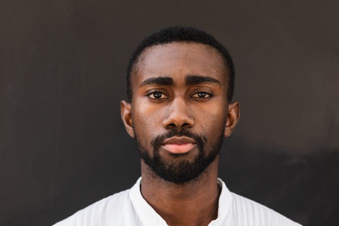 Black man in trendy clothes in city