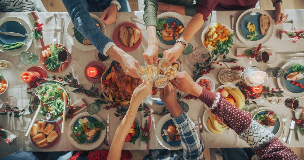 Top Down View on People Raising Champagne Glasses and Toasting, Celebrating a Holiday Together