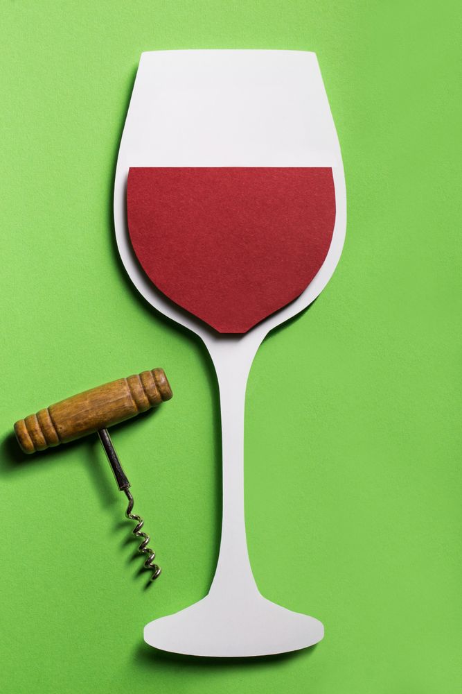 Silhouette of a glass of red wine made with cardboard