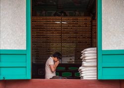 Busan, South Korea - August, 05 2017: Asian woman praying at home