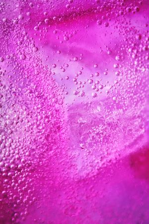 Ice with lilac colored tonic