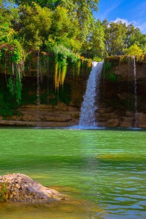 View of beautiful waterfall and lake