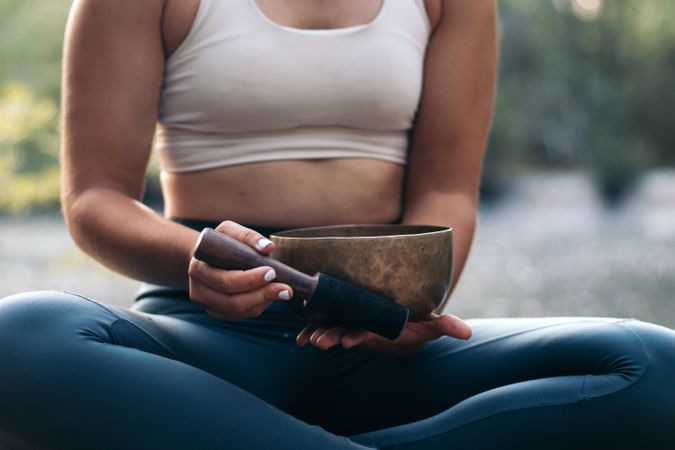 Young woman meditating and doing yoga in nature