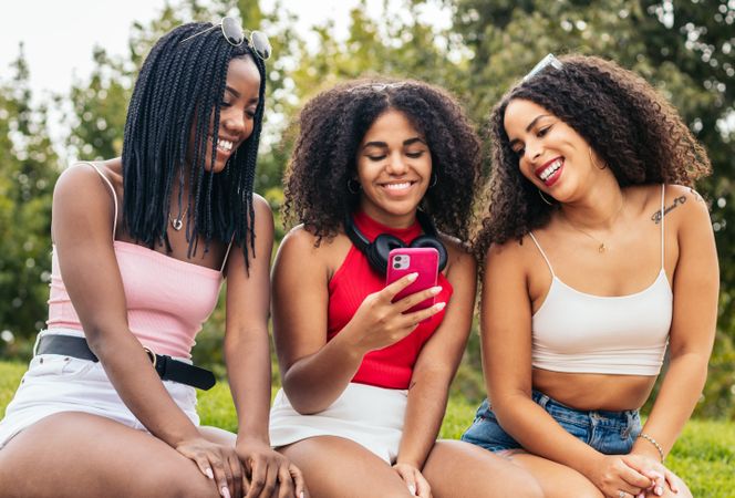 Black Friends Enjoying Summer Together and using smartphone