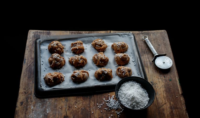 Sugar and cutter near cardamom buns