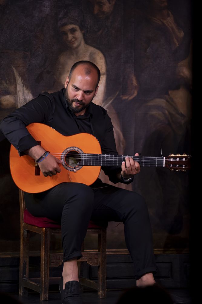 Man playing guitar on stage