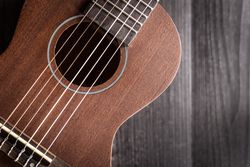 Ukulele on wooden tabletop