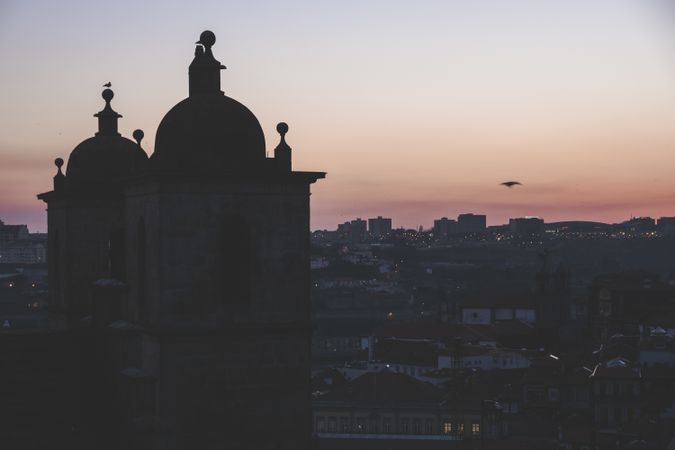 Dusky view of cathedral against cityscape