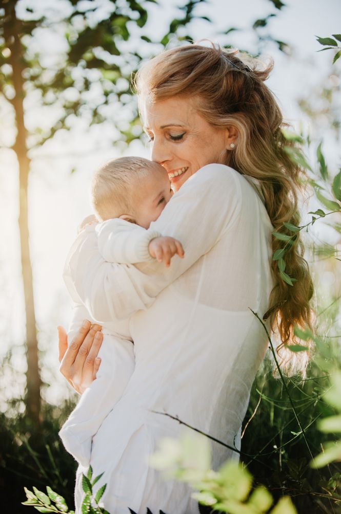 Grandma kissing her grandson in the park