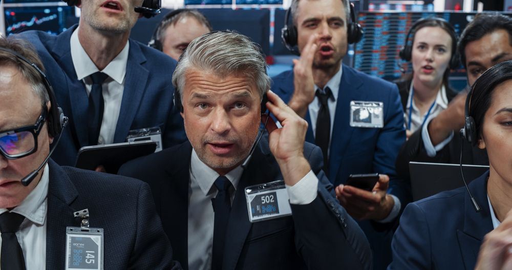 Portrait of Professional Traders Working on a Stock Exchange. Enthusiastic Men and Women Shouting, Signaling Orders for Company Shares and Commodities to Brokers at an Open Outcry Arbitrage