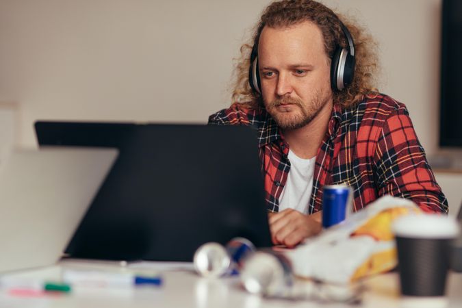 Man busy coding on laptop
