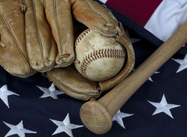 Vintage baseball equipment on US Flag