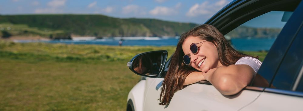 Woman leaning on window of the car