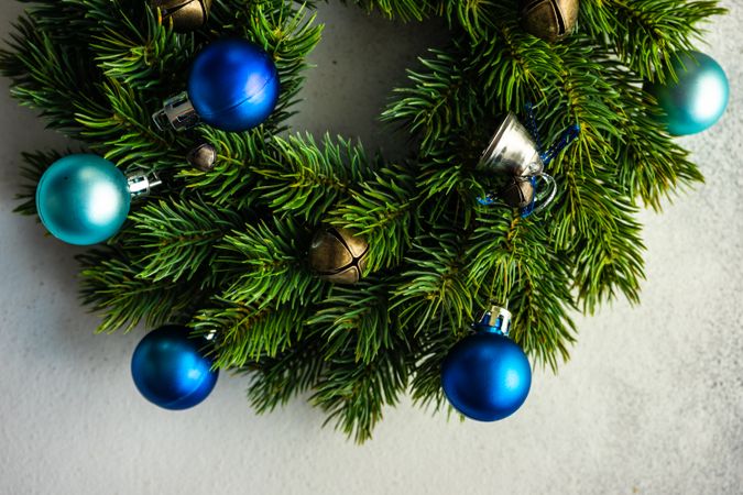 Christmas wreath with blue baubles on marble counter