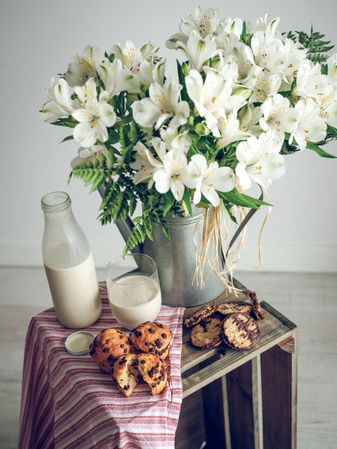 Bouquet of flowers in vase with food