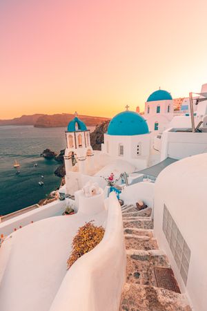 Hazy sunset in Santorini with blue domes