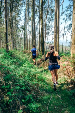 Young woman and man doing trail