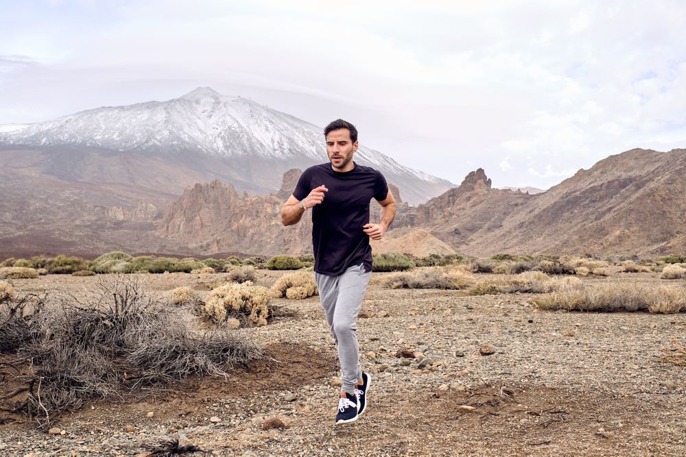 man running near mountain