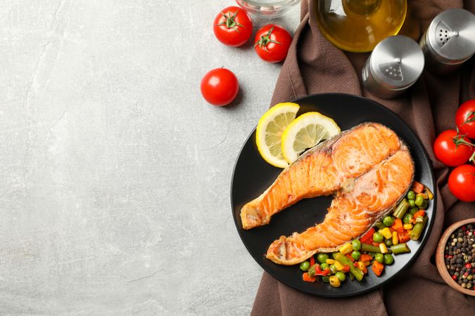 Composition with tasty grilled salmon on gray background, top view