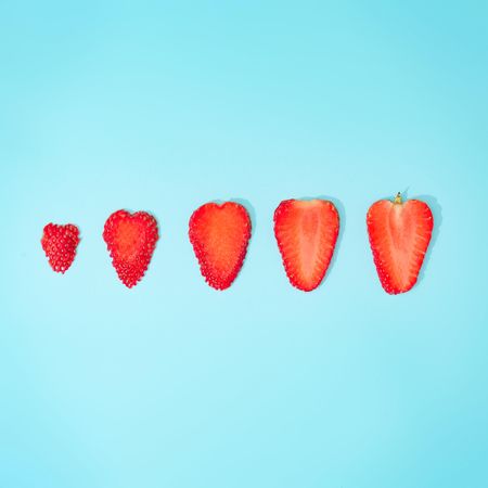 Creative summer background composition with strawberry slices
