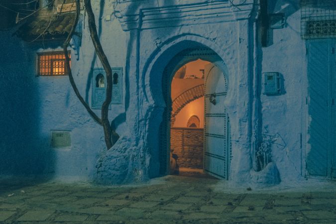 Ancient building with vintage doors at night