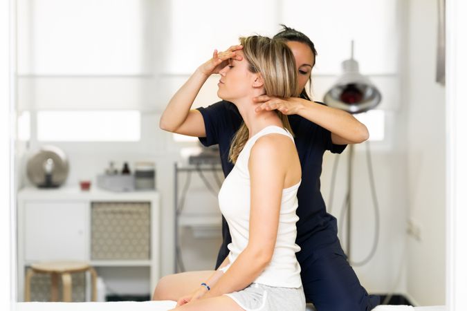 Physio working on client’s neck