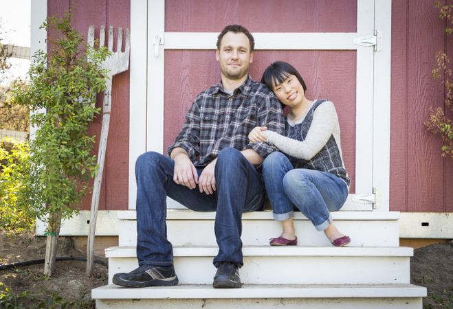 Interracial Couple Relaxing on the Steps
