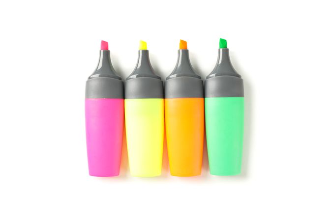 Color office highlighters isolated on plain background, top view