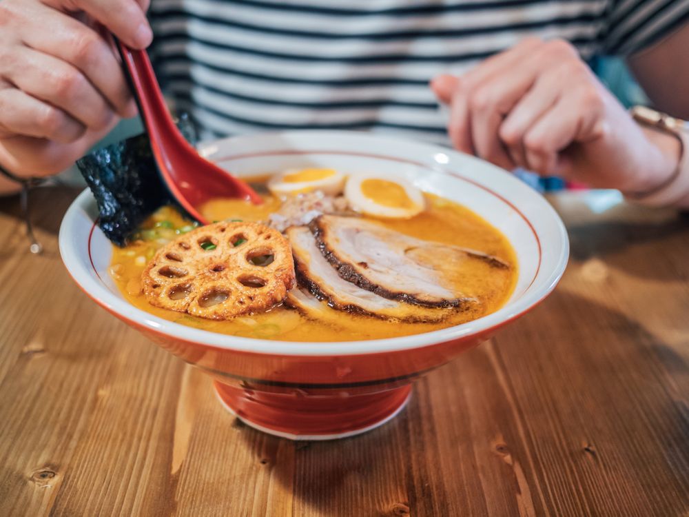 Female eating Japanese dish